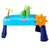 Toy water table with green Island, palm tree, and orange wheel on a white background