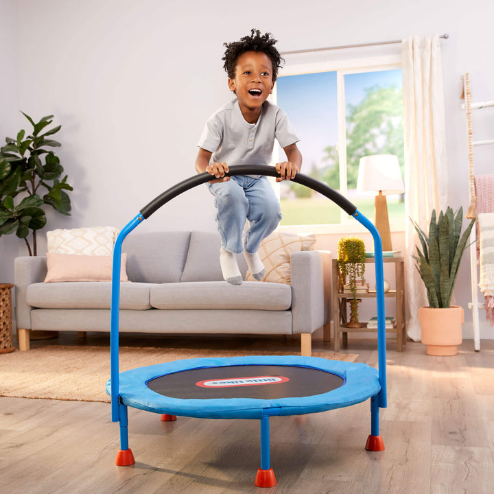 Boy jumping on trampoline