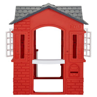 A red plastic playhouse with a dark gray shingled roof, white shutters, and a back mail slot, shown on a plain white background.