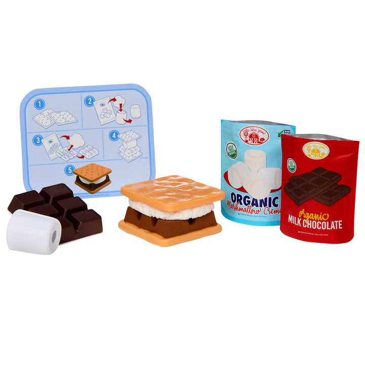 Toy s'mores set with chocolate bars, marshmallows, and a recipe card on a white background