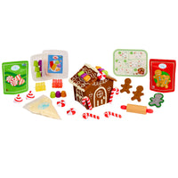 Gingerbread house kit with various gingerbread-themed items on a white background