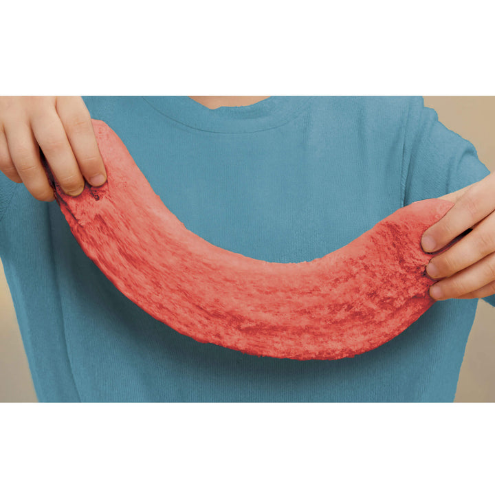 Child stretching red sand