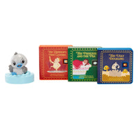 Toy figure of a duckling on a small ice block with three animated book covers in the background.