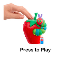 Toy strawberry with a caterpillar and a hand pressing a button labeled 'Press to Play' on a white background.