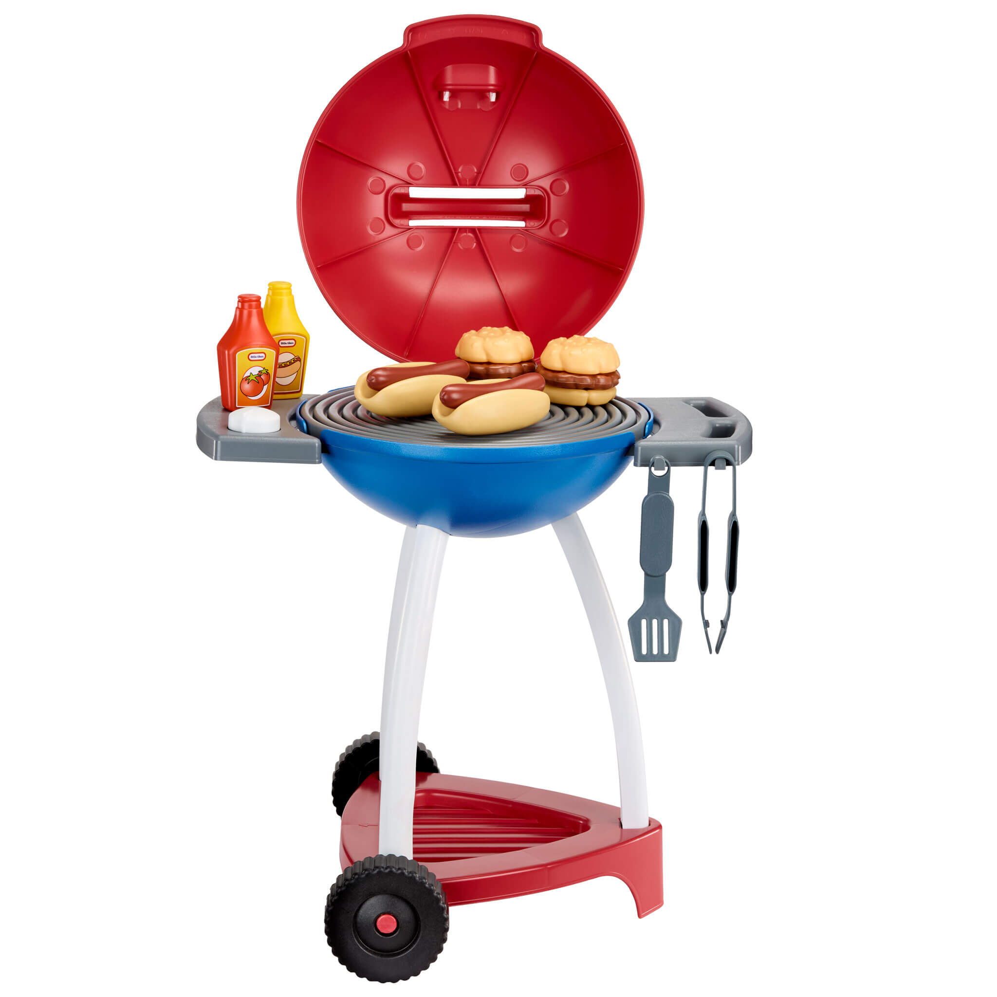 Grill with food, utensils and condiments
