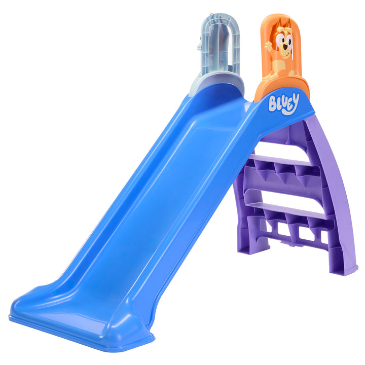 Colorful slide, on a white background, slide is blue, steps are purple, Bingo is showing as one of the slide handles, the other handle is blue backside. ‘Bluey’ logo is on the slide under Bingo.