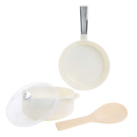 White-colored cookware set including a frying pan with a silver handle, a saucepan with a clear lid, and a spoon, displayed on a solid white background.