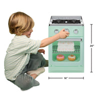 A child kneels beside a mint green toy stove oven with dimension callouts showing 14 inches wide and 20 inches tall, on a white background.