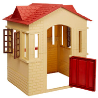 A playhouse with a beige brick-textured exterior, a red tiled roof, and an open red door, shown on a plain white background.