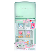 Toy refrigerator with toy food items on a white background
