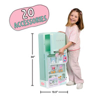 A young girl stands next to a pastel mint green toy refrigerator with shelves and accessories, shown with dimension lines indicating 30 inches tall and 13.5 inches wide.