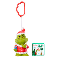 Toy figure Santa Grinch with a book on a white background