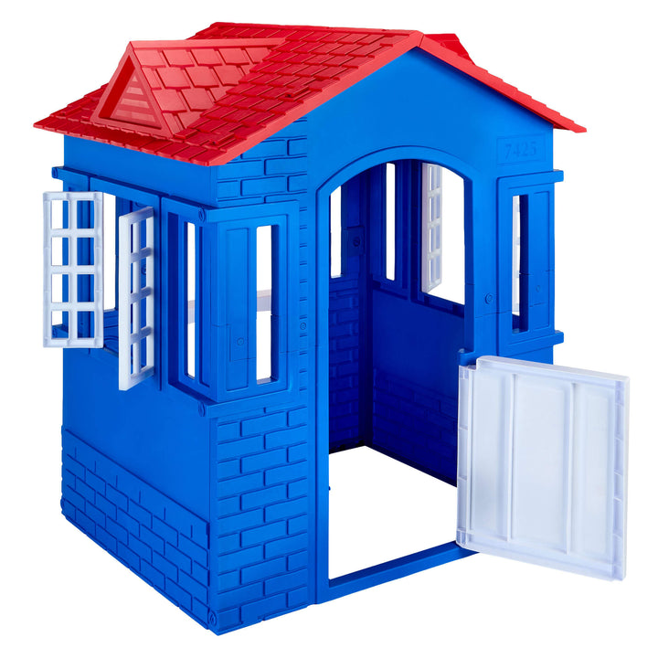 A blue plastic playhouse with a red tiled roof, white open door, and white window shutters, shown on a plain white background.