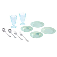Set of light blue dinnerware including plates, glasses, and silver utensils on a white background.
