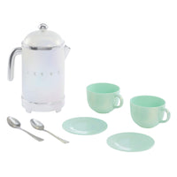 Tea set with white teapot, mint green cups and plates on a white background