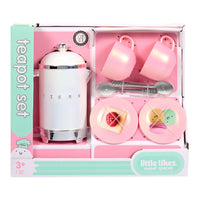Pink toy teapot set with cups and utensils in packaging labeled 'little likes sweet spaces'.