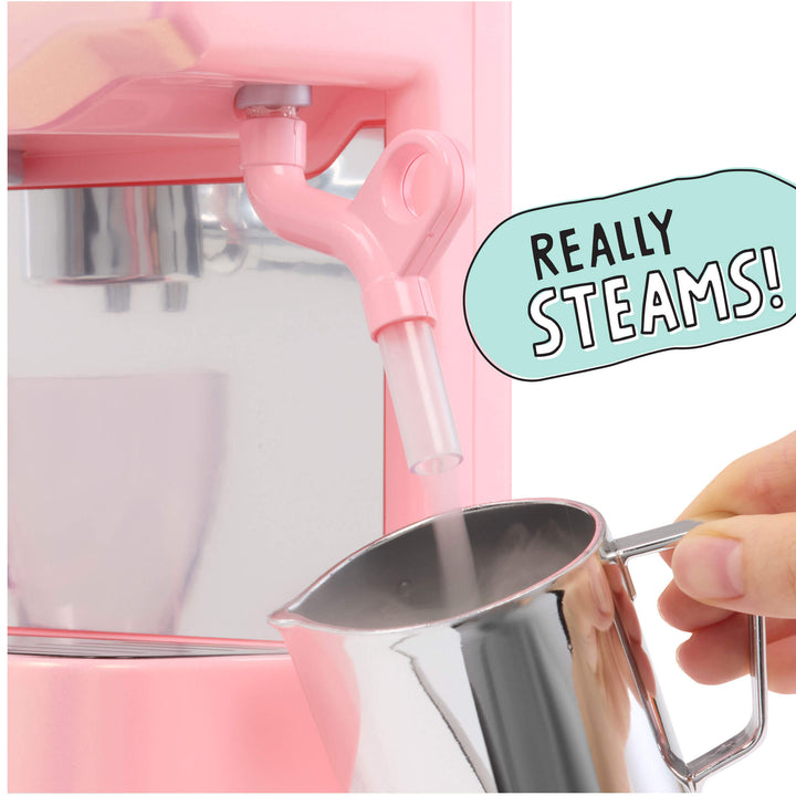 A pink espresso machine  dispensing steam into a pitcher held by a hand, with a mint-green speech bubble reading 'REALLY STEAMS!' on a white background.