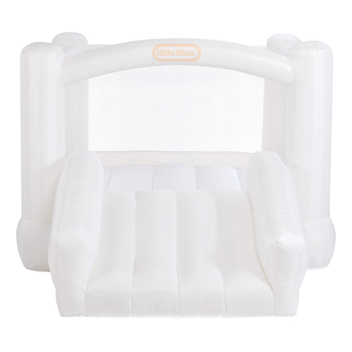 A white inflatable Little Tikes, featuring a slide, side bumpers, and a small arched opening at the top with the brand logo.