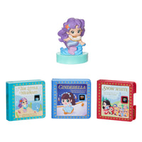Set of three children's books with a toy Mermaid on top, featuring different scenes and text.