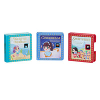 Three children's books ’The Little Mermaid’, Cinderella and Snow White against a white background