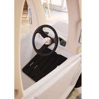 Black steering wheel with white horn button and black floorboard