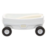 Sideview of the white wagon with with the beige handle folded inside the wagon and a beige Little Tikes logo on a white background