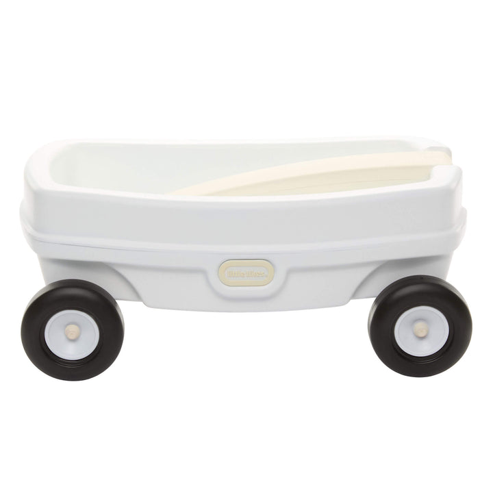 Sideview of the white wagon with with the beige handle folded inside the wagon and a beige Little Tikes logo on a white background