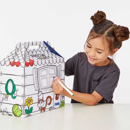 Rescue Tales™ Adoptable Pets - Poodle - 
Flip the box inside out and kids can color it to customize their pup’s doghouse