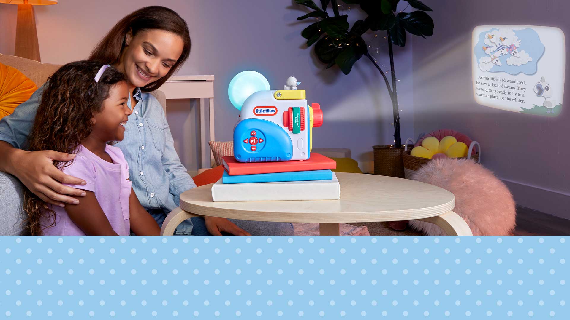 Woman and child interacting with a toy projector in a room setting.