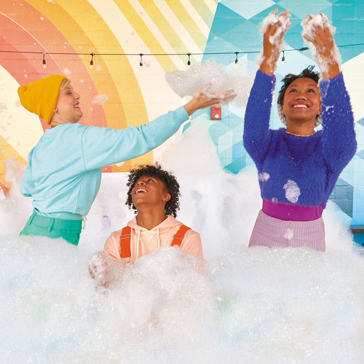 Parents and kids playing in bubbles